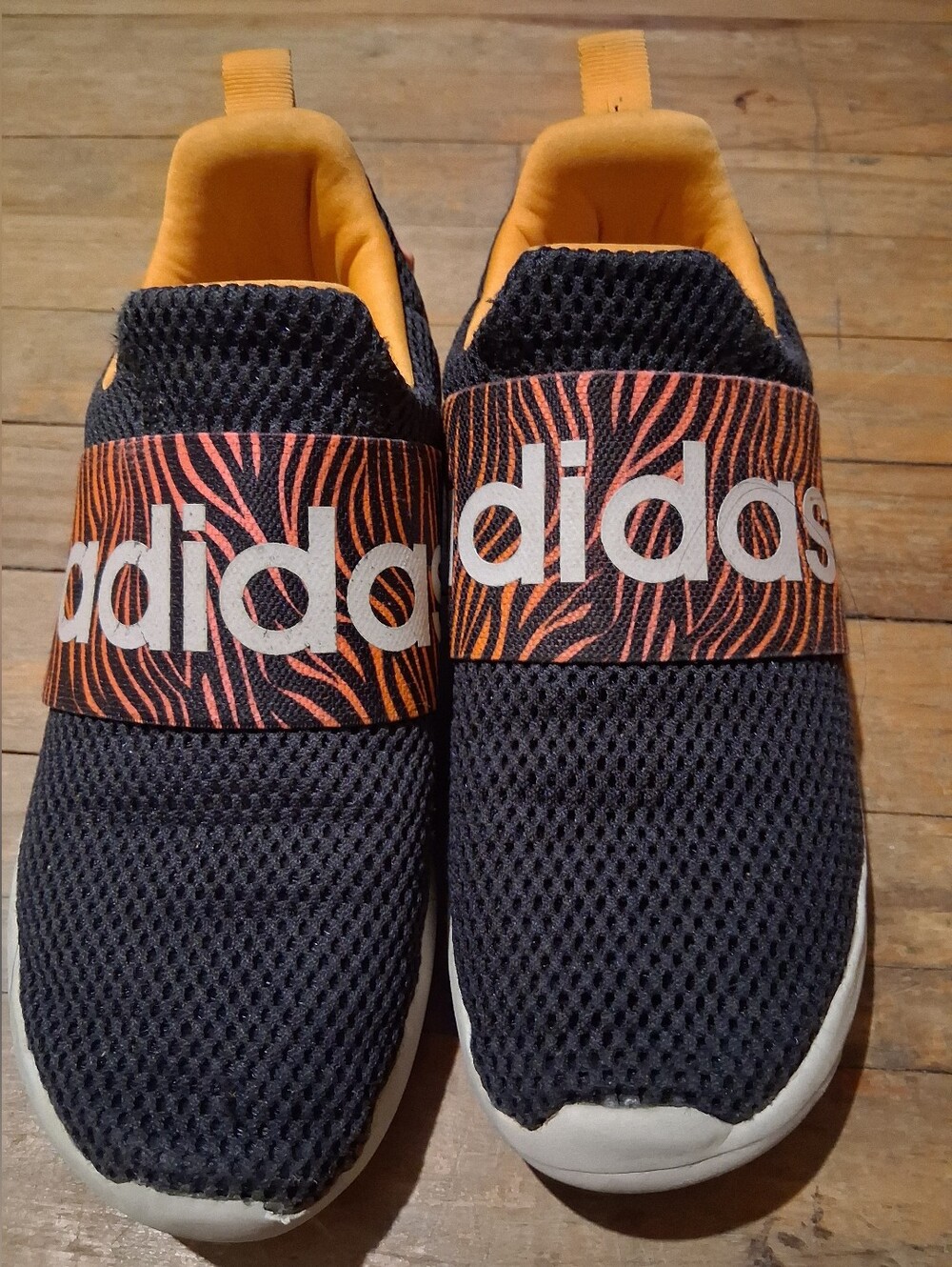 adidas Black Slip-On Sneakers with Orange Zebra Strap